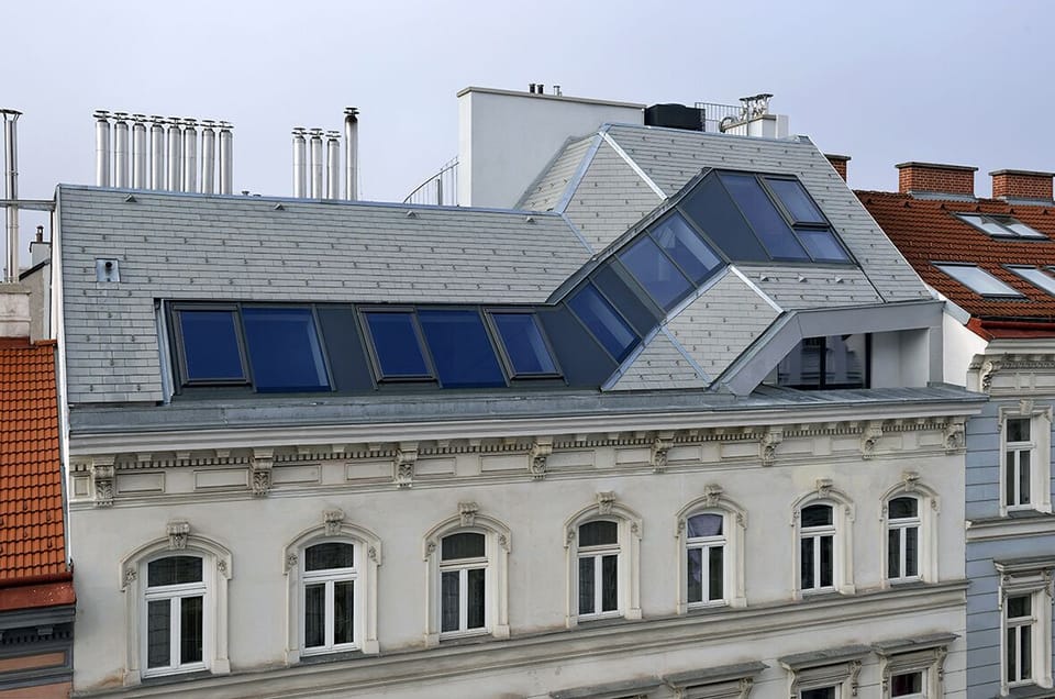 view of penthouse loft from across the street