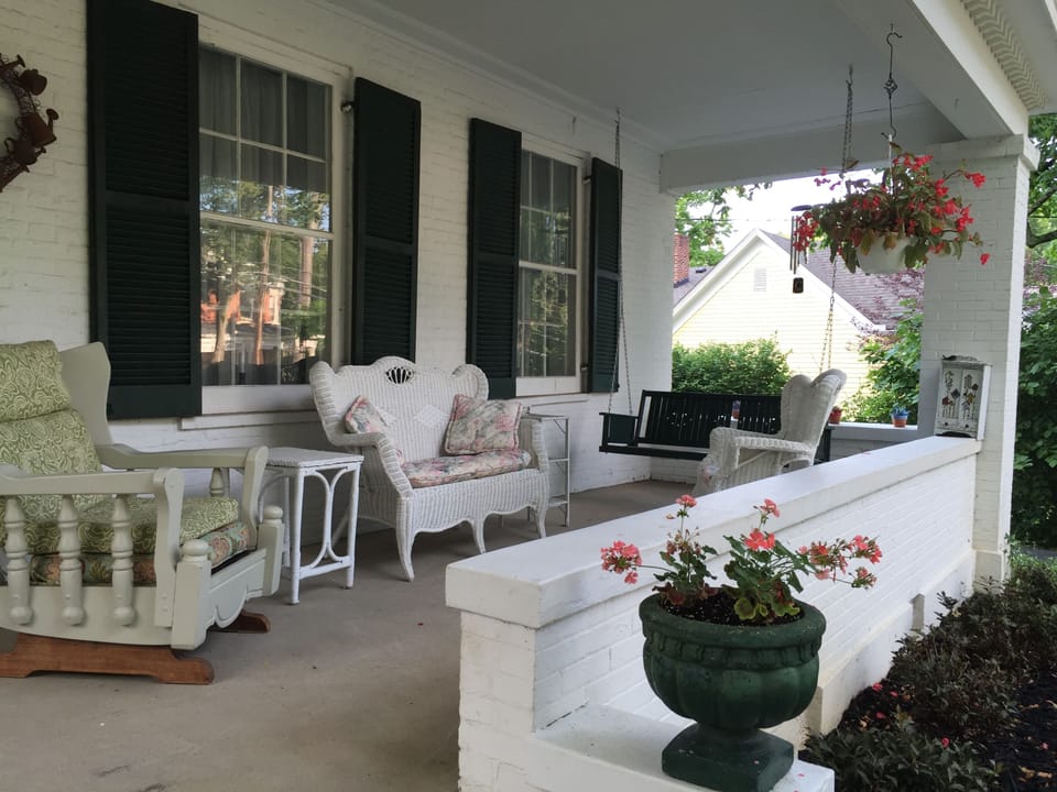 Cozy front porch in a quiet neighborhood!