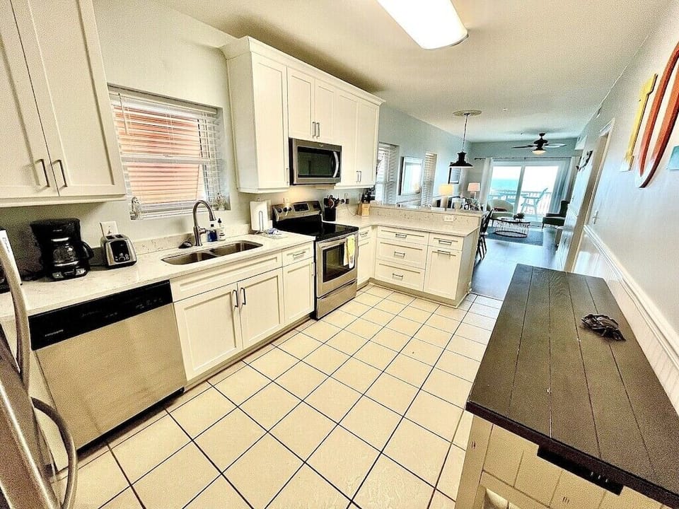 Kitchen with stainless steel appliances and prep island Oceanview, 201 Isle of Palms, SC | IOP Escapes