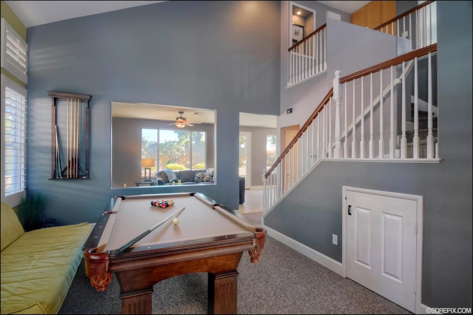 pool table with small door leading to playroom for little ones!