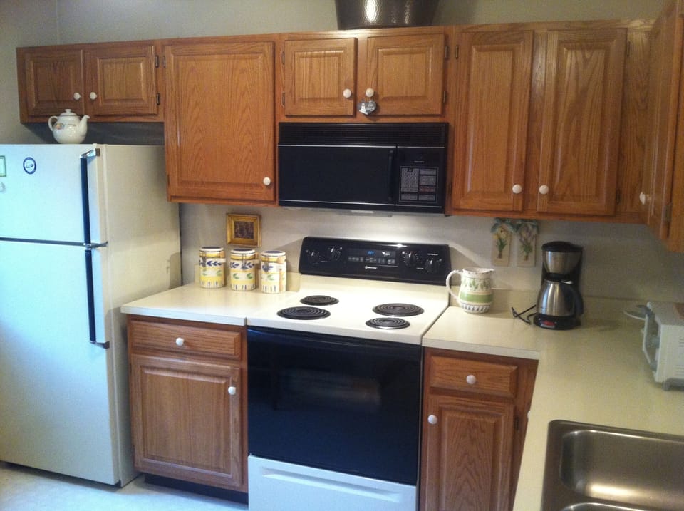 Our Kitchen with Fridge, Dishwasher, Microwave, Toaster oven, and Coffee maker 