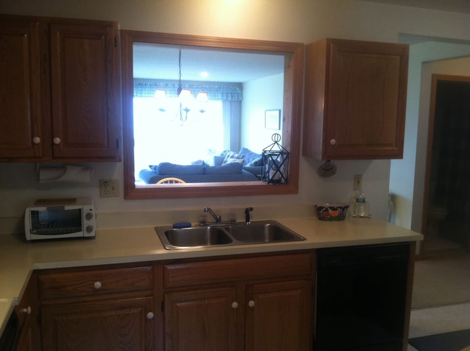 View into Living Area from the Kitchen. 2nd Bathroom is seen on the right.