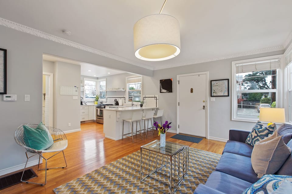 Open concept bright living room and kitchen. 