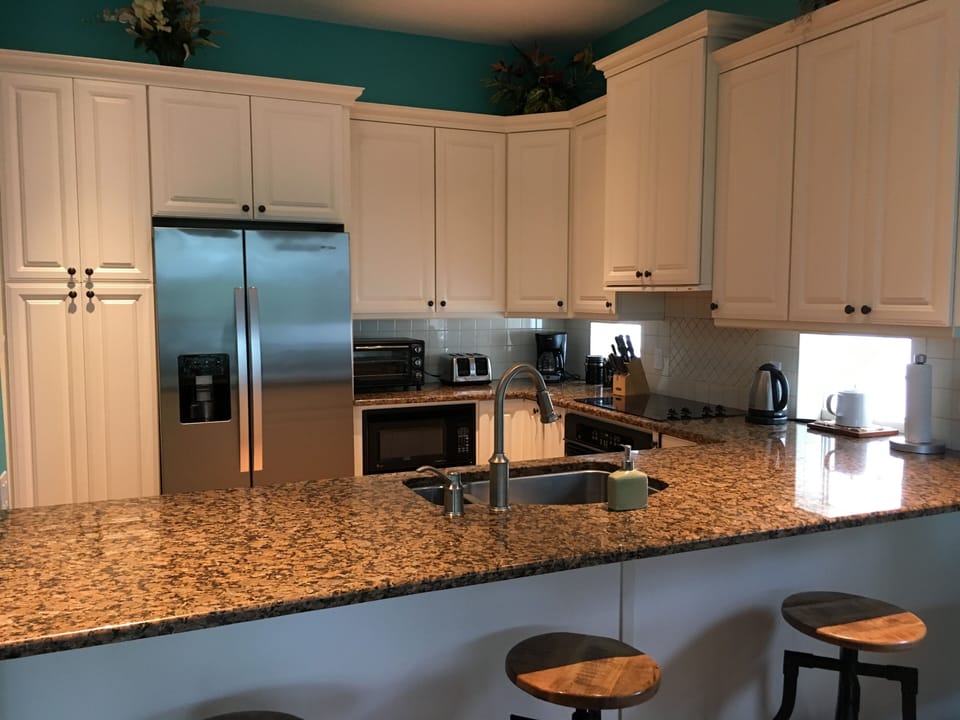 Granite worktops in custom built fully equipped kitchen.