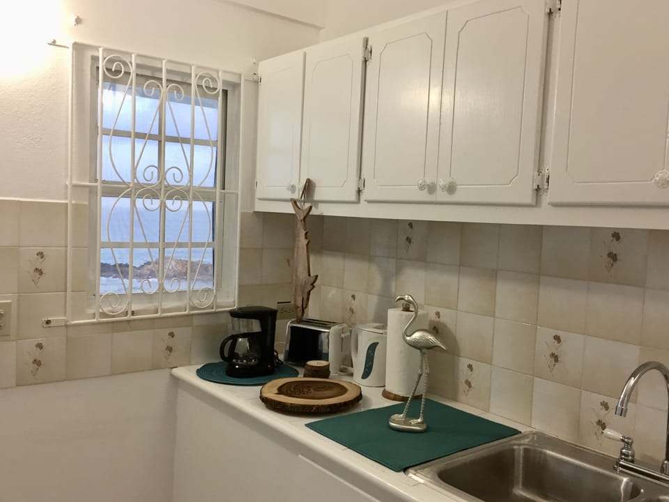 Meal prep area with coffee maker, toaster, hot water kettle