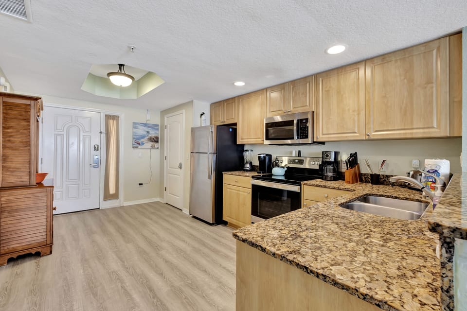 Full kitchen: refrigerator, dishwasher, stove/oven, microwave, coffee makers. 