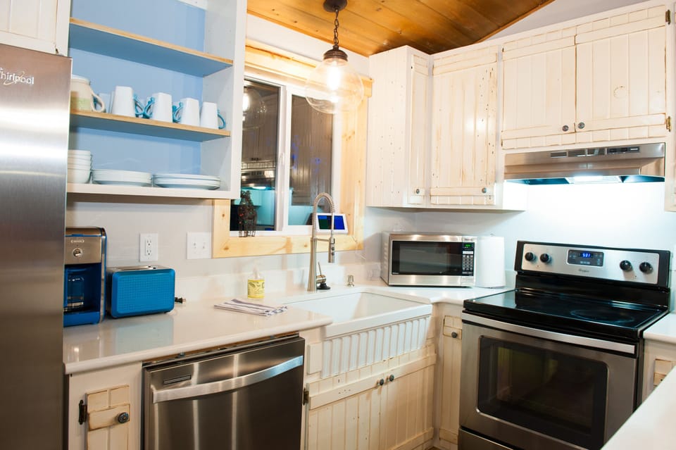 Kitchen with all new appliances, quartz countertops and farm sink