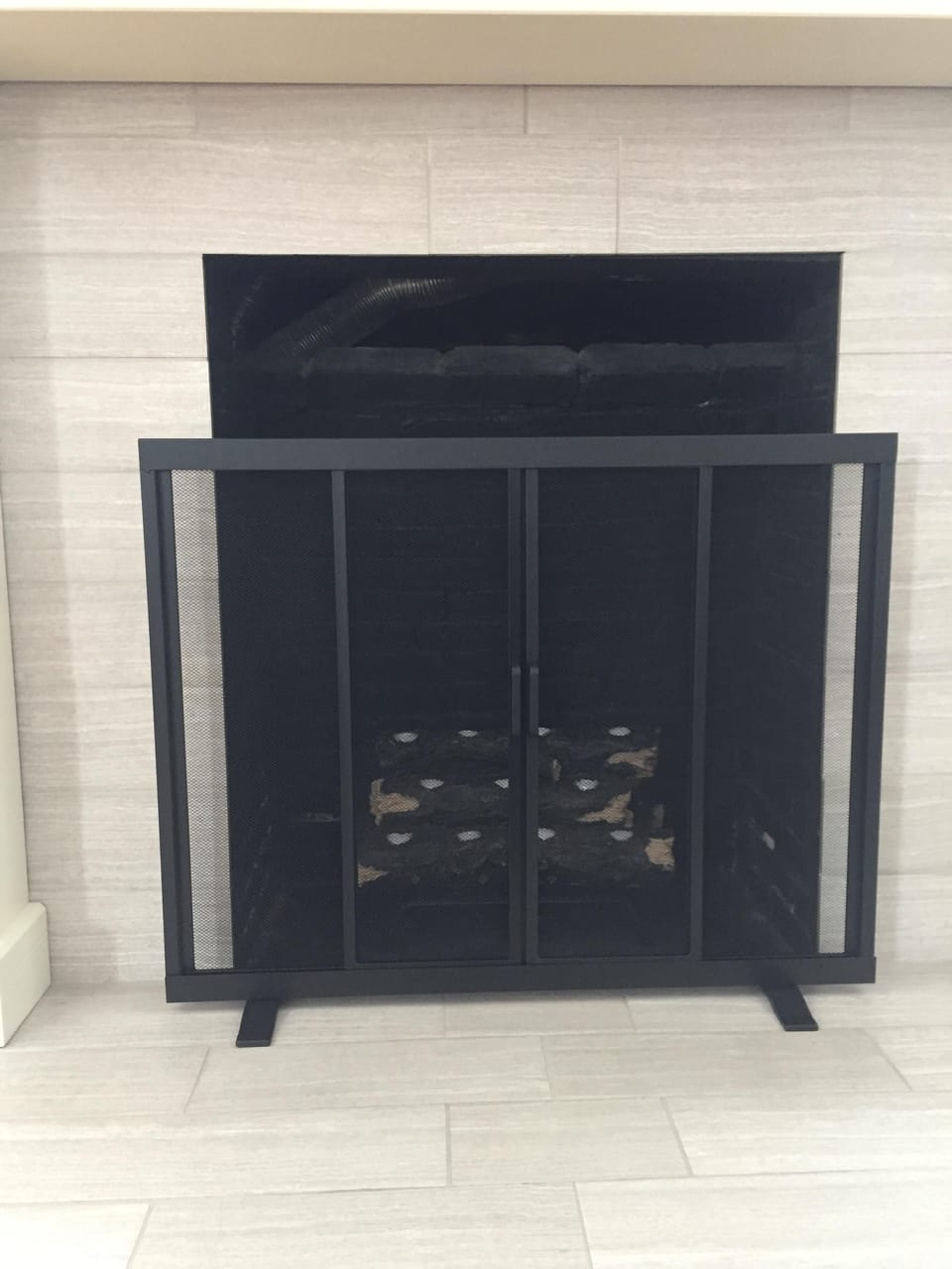 *Decorative* fireplace with resin logs that provide a warm glow with tea lights 