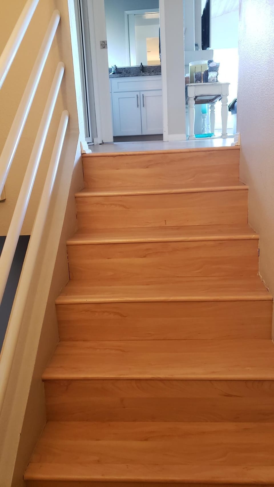 Steep steps from front door lower floor to upper floor.

