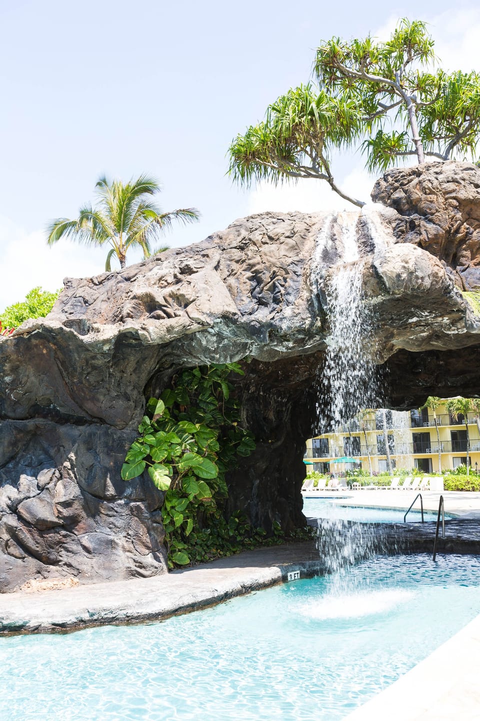 Romance swimming with the water fall by the pool