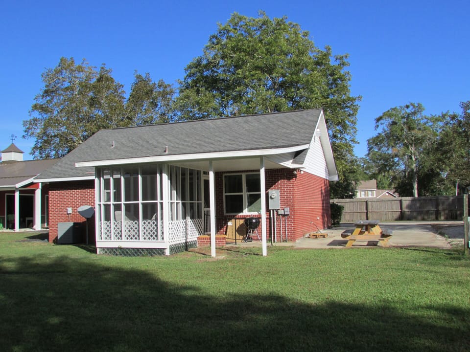 Back & Side of Cottage on private lane with plenty of parking even for trailers for Crusin on the Coast.
