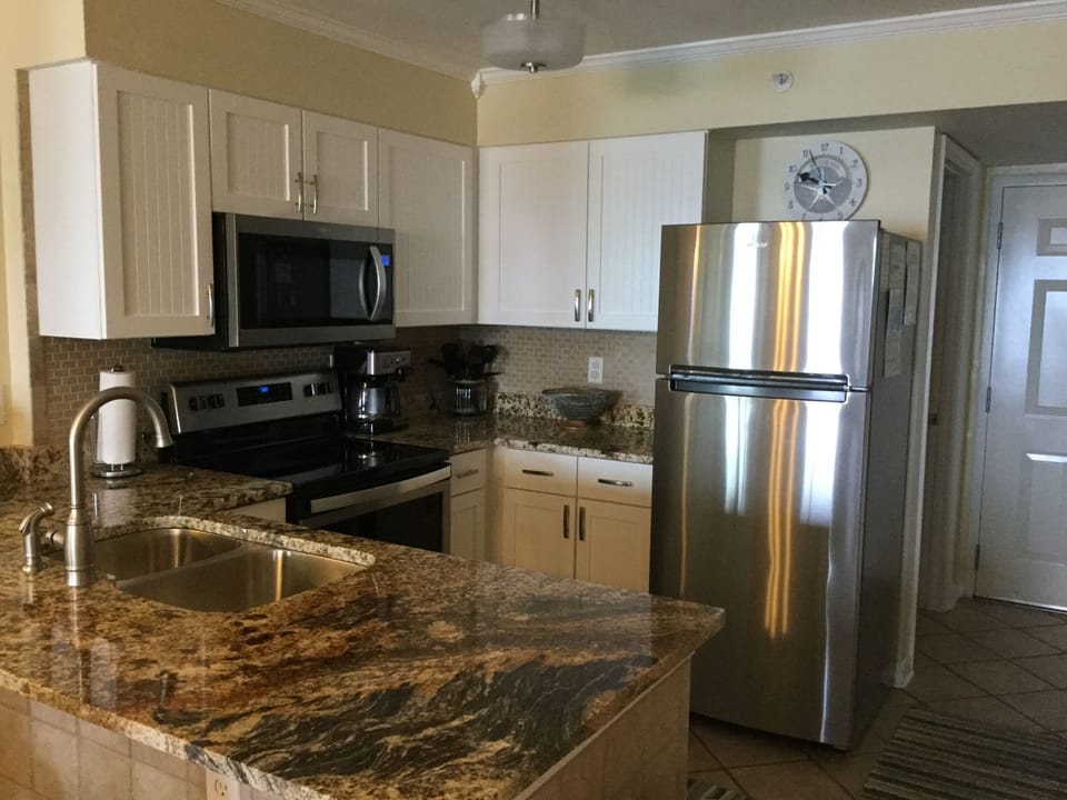 New kitchen light & beautiful granite countertop. New sink,  faucet & disposal