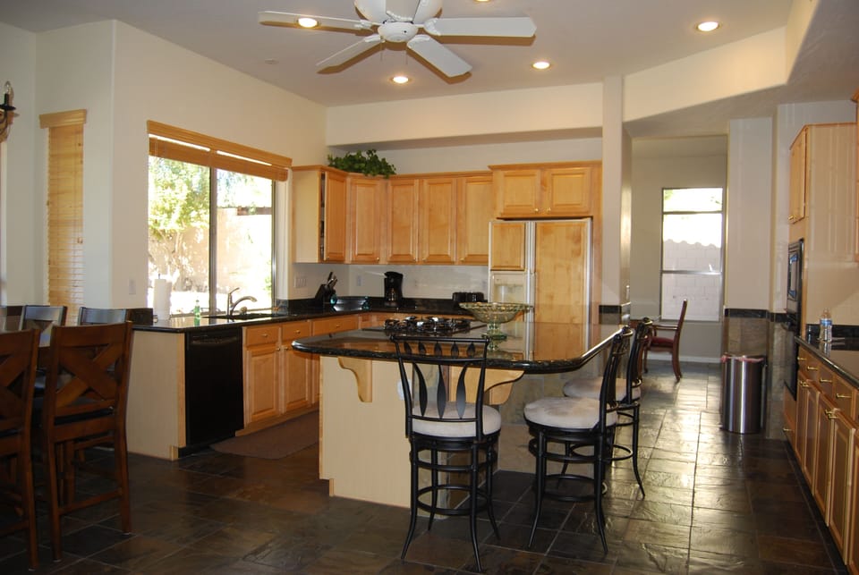 Fully equipped spacious kitchen, square informal Dining for 8 plus bar seating