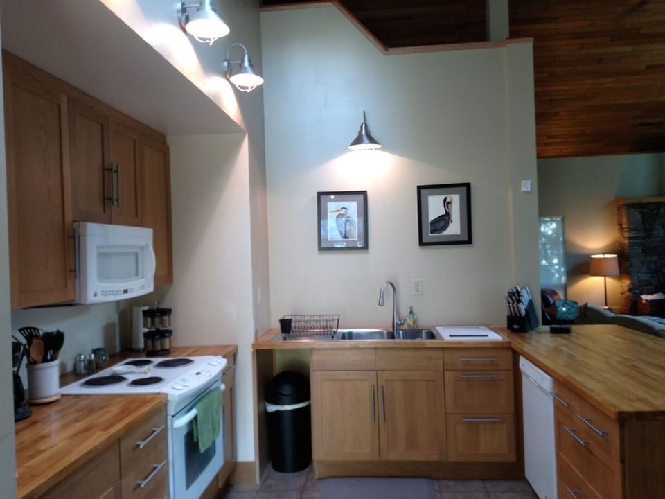 Well stocked and roomy kitchen -