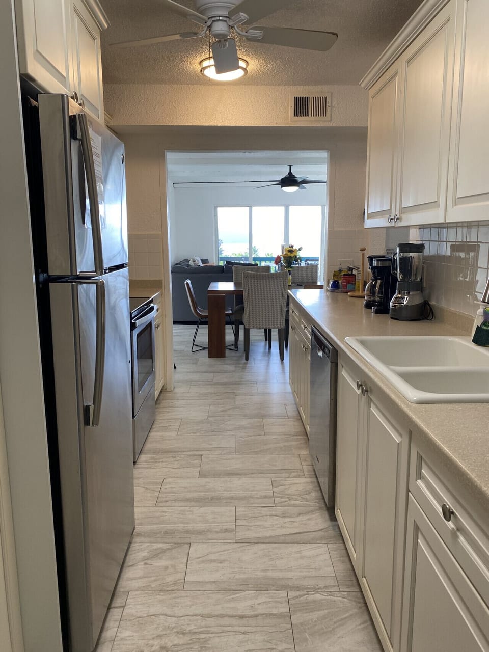 Fully equipped kitchen with modern appliances and dining area