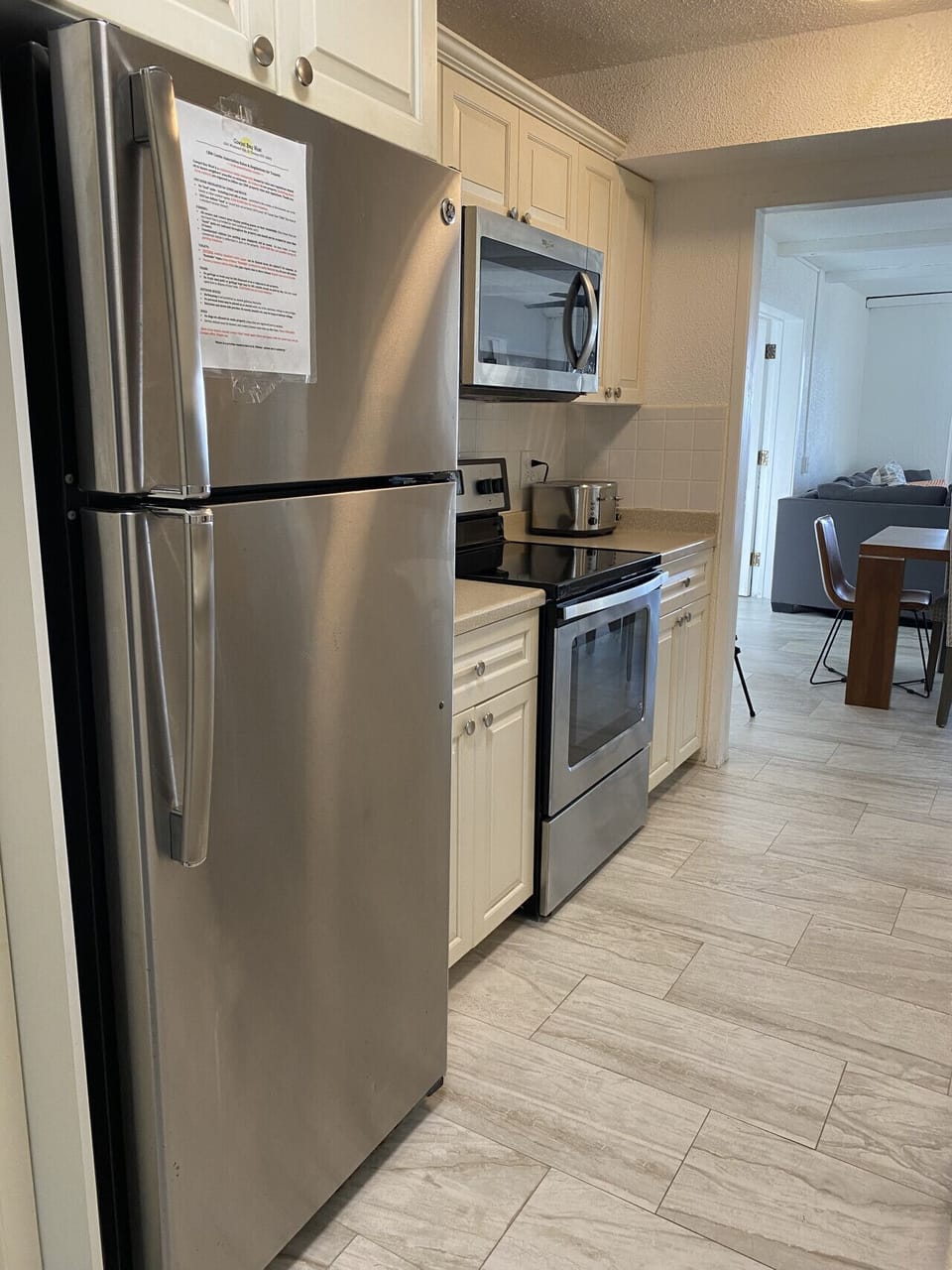 A real kitchen. Stainless appliances, counter space, and everything you need to cook a proper meal instead of eating out every night.