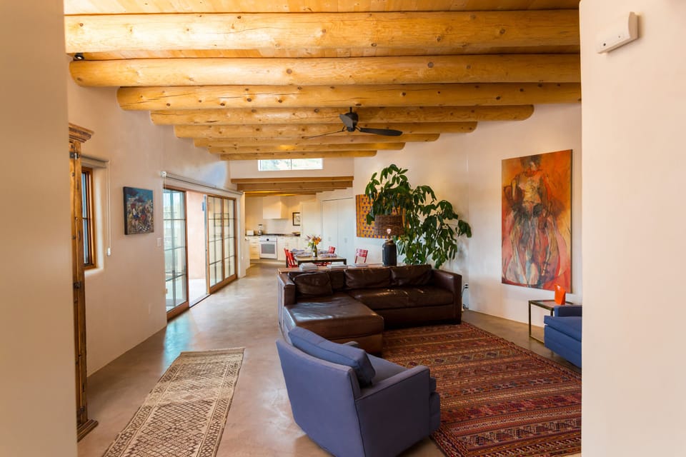 view of main room after entering

living,dining,kitchen,doors to yard from entry
