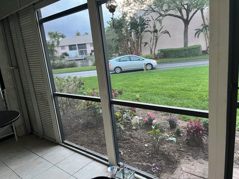 Rear Screened-in Lanai/Porch with View of Back Yard
