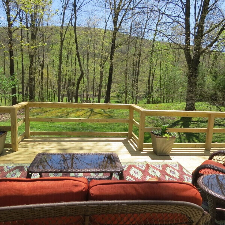 view of the river and yard from the deck