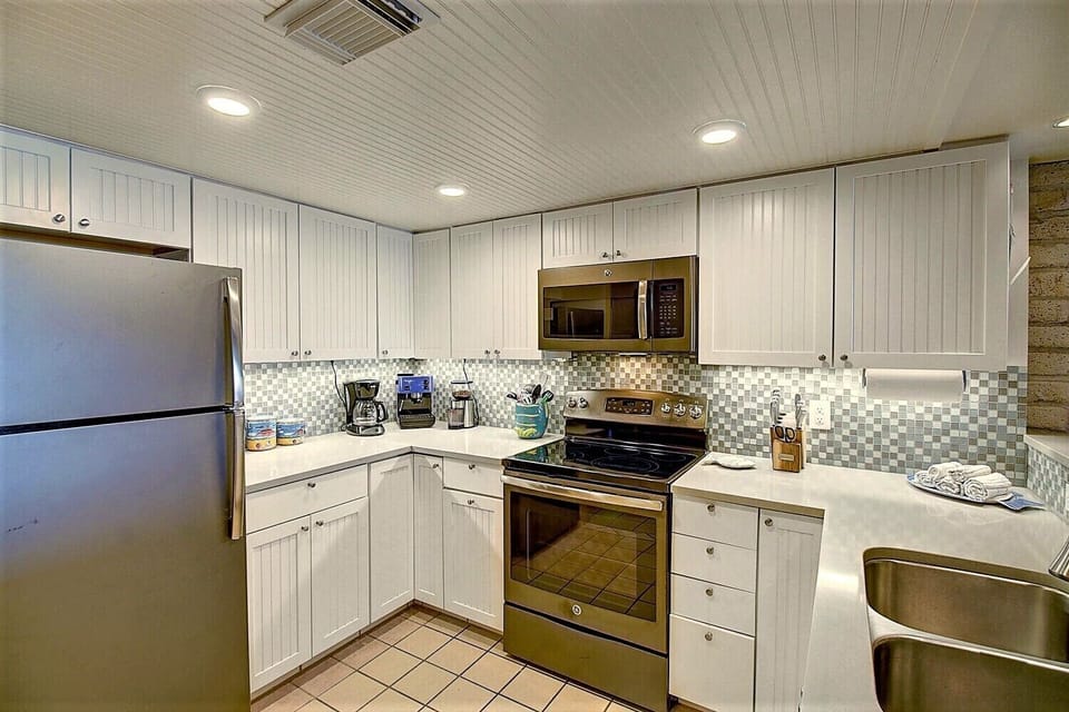 Updated clean kitchen with all the gear you need to fix your family any meal.