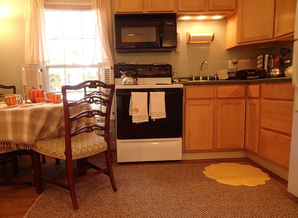 Here is the large eat-in kitchen with full size appliances and sunny window.
