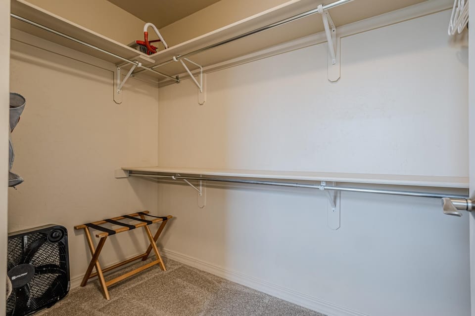 Spacious walk-in closet with ample storage.