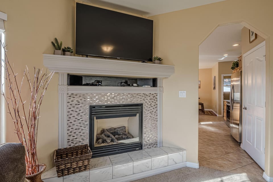 Modern fireplace and 65" Smart TV