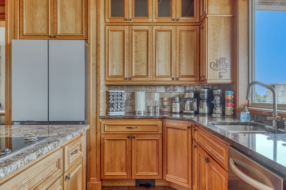 Kitchen has a large variety of high end  appliances/supplies for making coffee