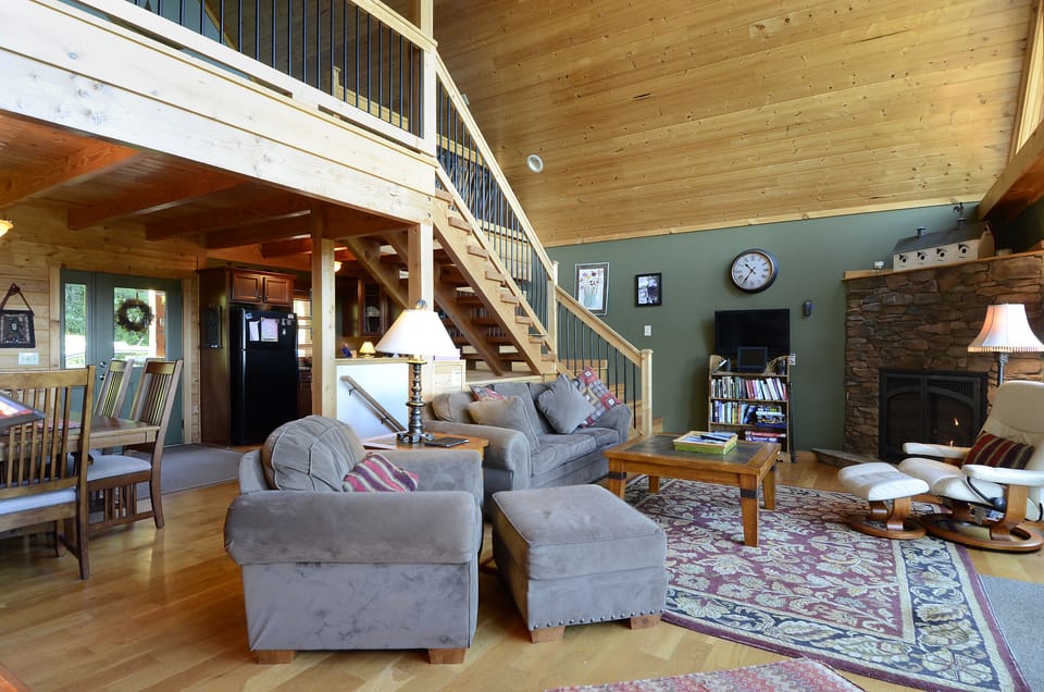 Living room, dining room, and kitchen in open main level floor plan.