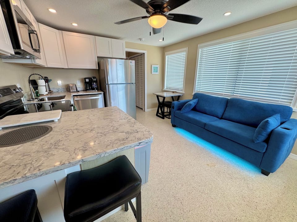 All new bright interior with movie style sofa sleeper and 43 inch cable tv