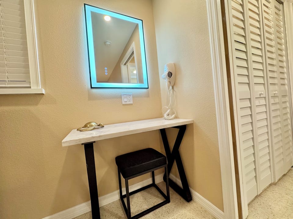 Desk Vanity with Quartz top and wall mounted hair dryer