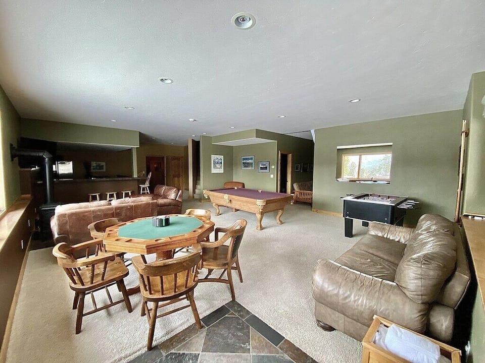 Game Room - Pool table, poker table, foosball table, bar, and hi-def tv multiple couches. Hot tub is right outside