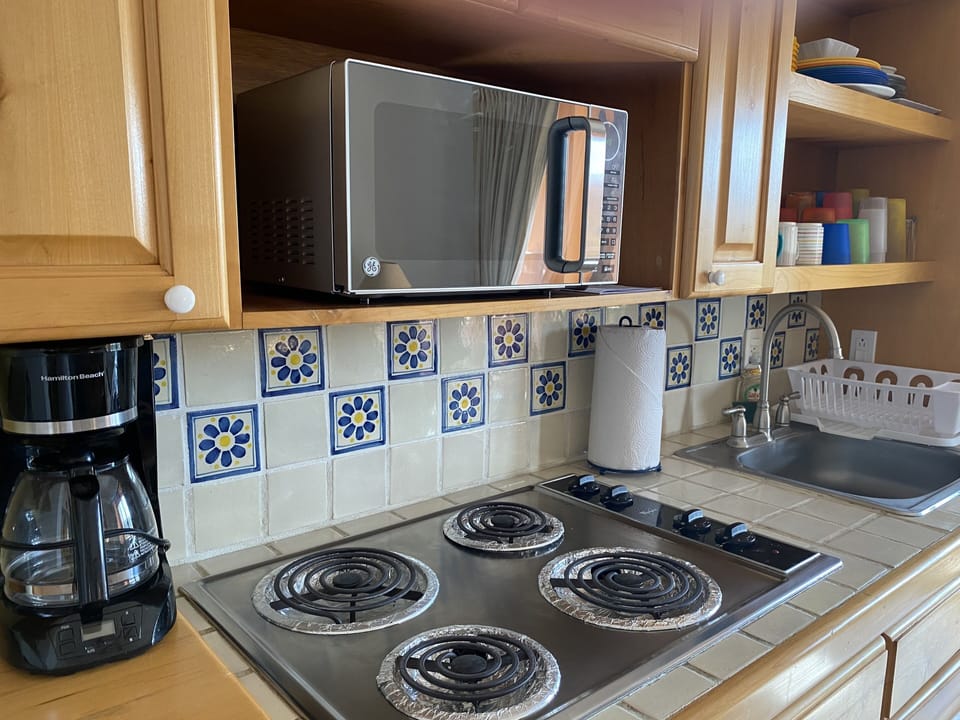 4 burner stove, microwave, coffee maker, blender, etc. 