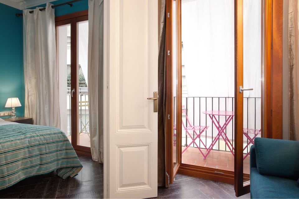 View of the balcony at the third bedroom. We have two tables with 4 chairs.