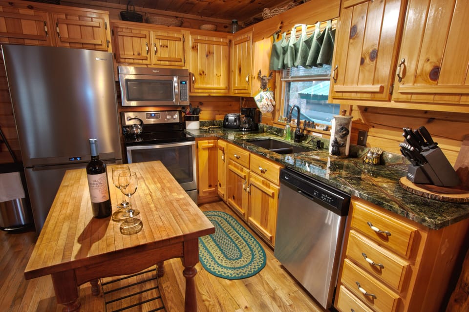 Upgraded Kitchen with new appliances and granite countertops.