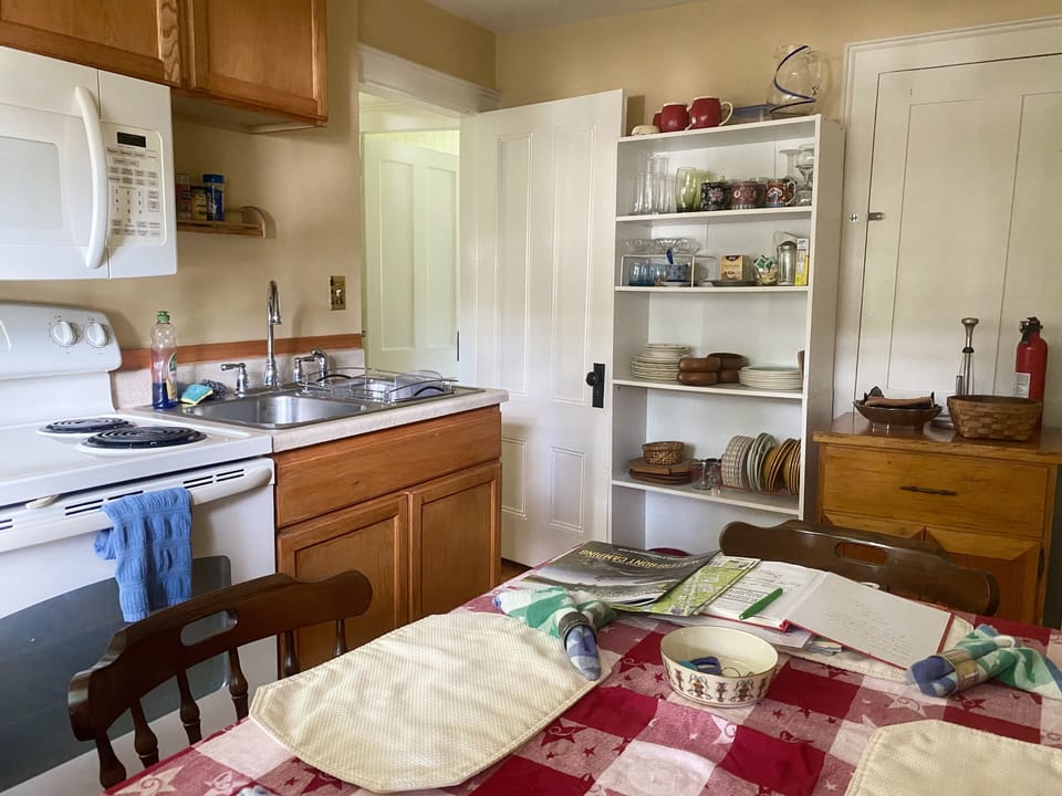 Full size appliances are in the kitchen & everything you need to cook from home.
