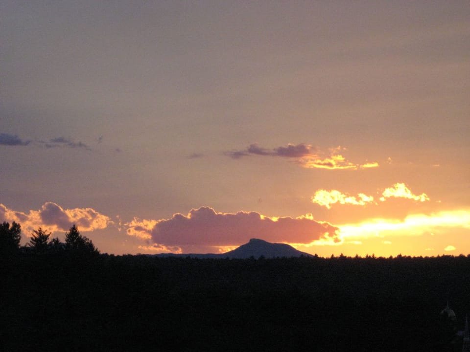 This is the sunset in our back yard looking at the state capital and Camels Hump