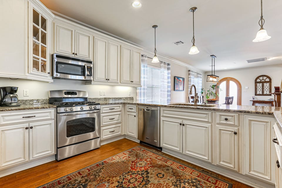 Kitchen features coffee pot one cup or full pot.