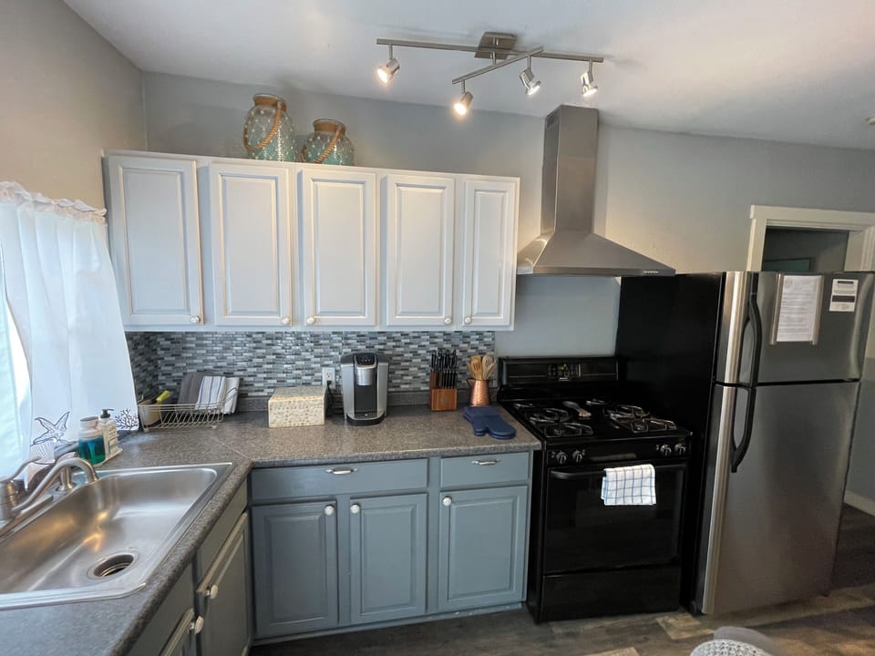 Full kitchen. Well stocked. Brita water filter. Ice maker. Keurig coffee maker.