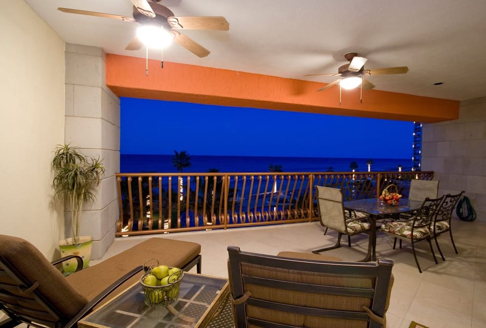 Patio with two lounge chairs and table for six.  Great oceanfront views!