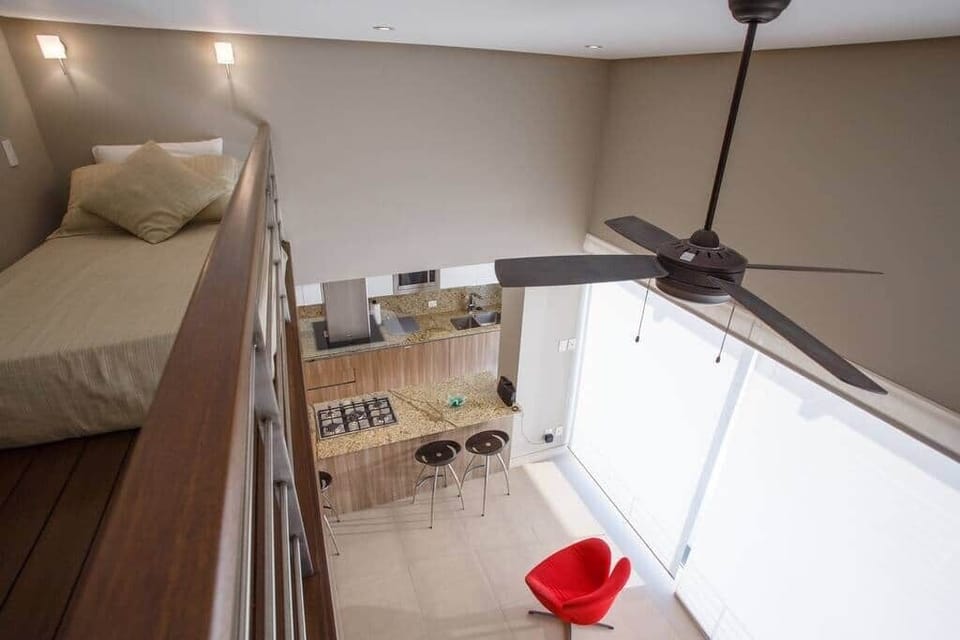 A small loft with a single bed is located above the living area. 4' ceiling in this area