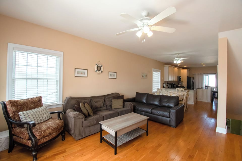 2nd floor Living room area with seating and open concept view of dining/kitchen