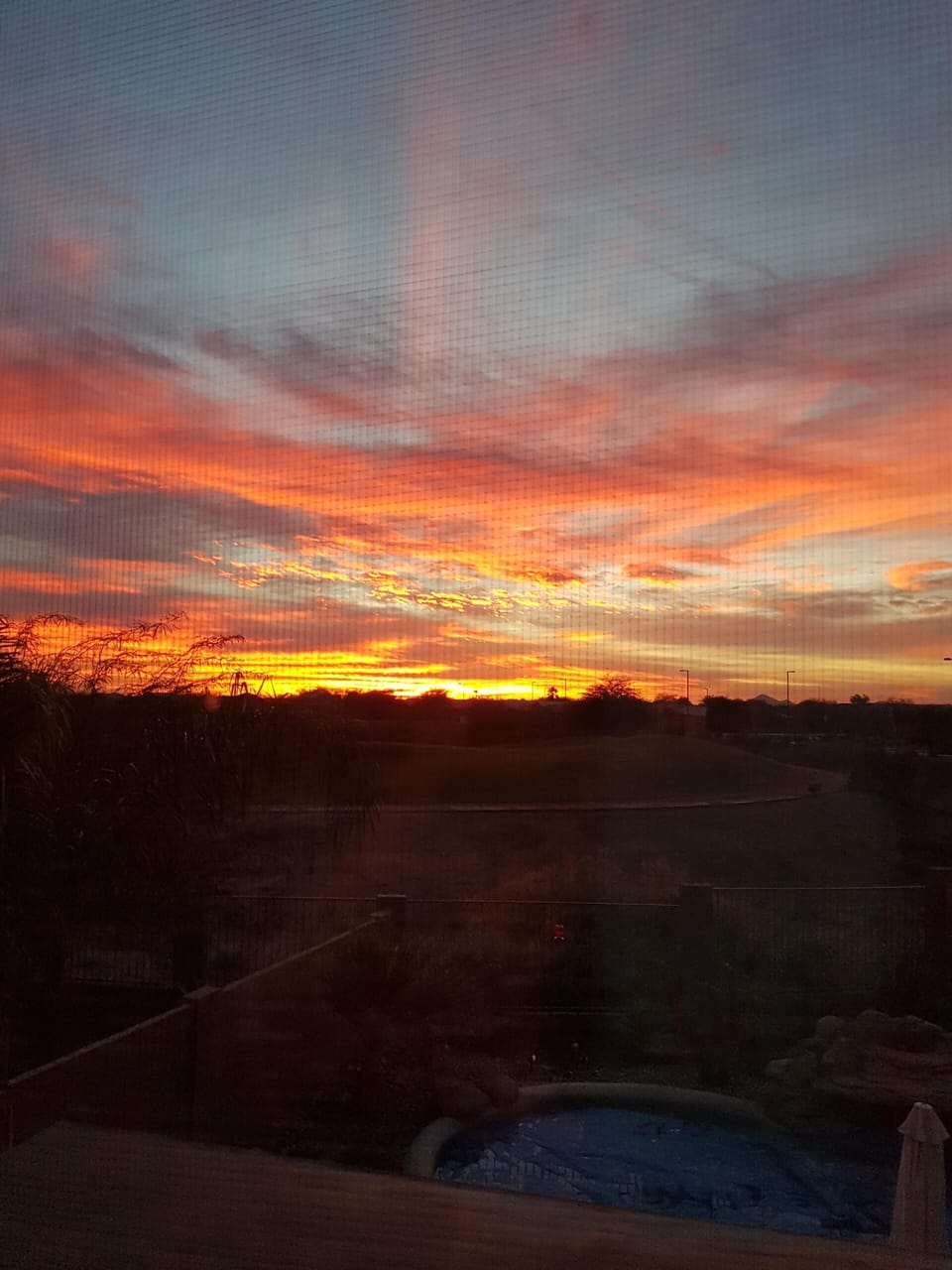 Enjoy beautiful sunsets from the back patio and Media Room.