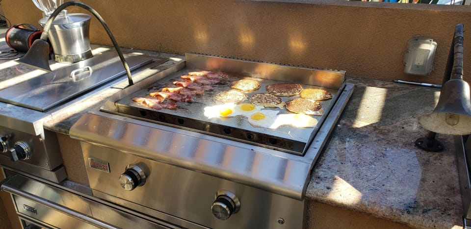 A large outdoor griddle just waiting for your perfect breakfast.