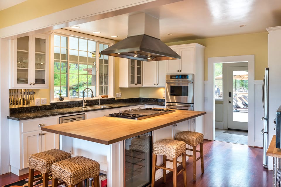 Fully stocked chef's kitchen inside with large griddle, 4 burners, dual ovens ++