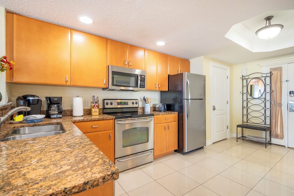 Full kitchen: refrigerator, dishwasher, stove/oven, microwave, coffee makers. 