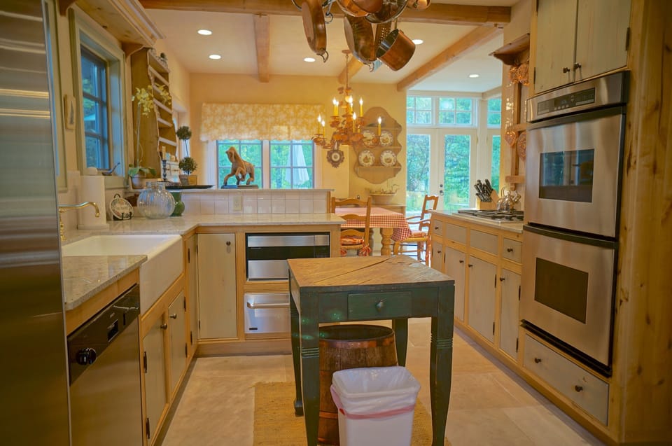 Enjoy a Sub Zero fridge, dishwasher, 4 burner gas range and dual Dacor ovens