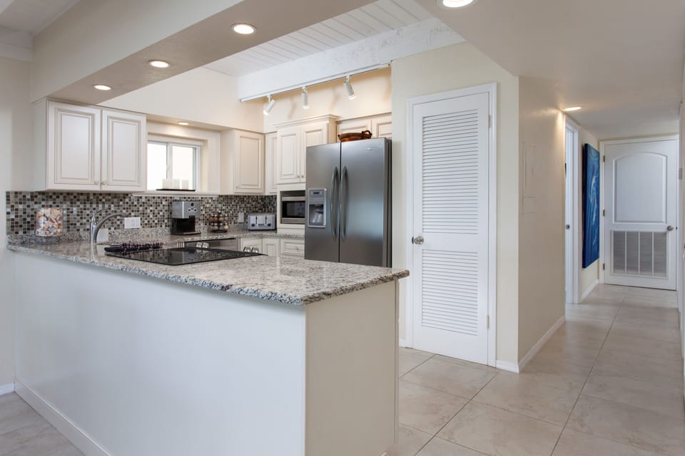 Stainless Steel Kitchen Appliances, Custom  Cabinets, and Granite Countertops.