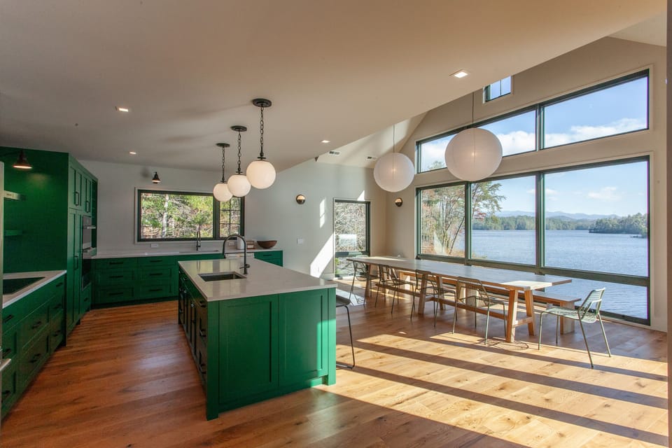 New custom kitchen with custom 12'-0" dining table. The view is the main thing