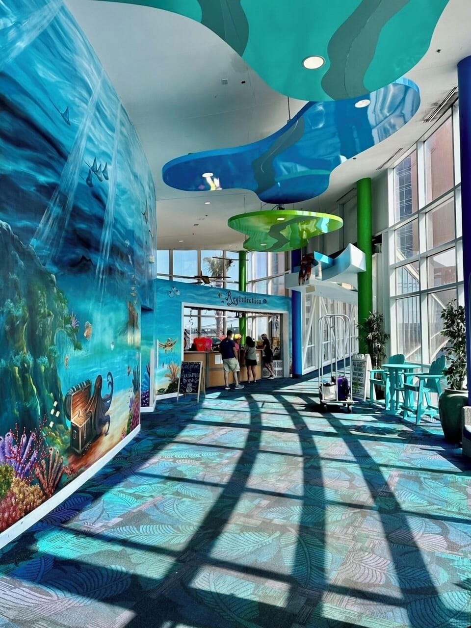 Splash Resort welcome desk, lobby area, and entrance to sky bridge to towers
